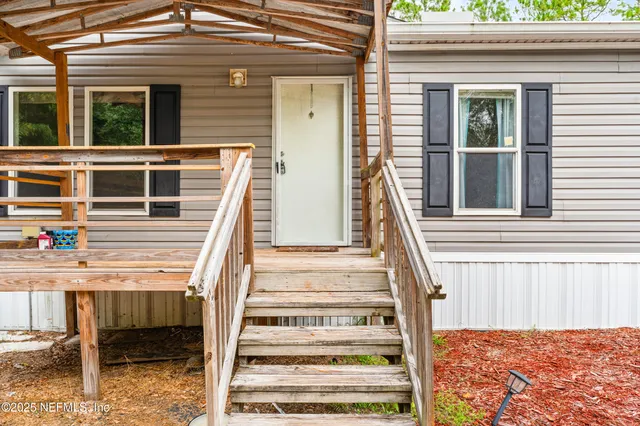a view of a house with more windows and furniture