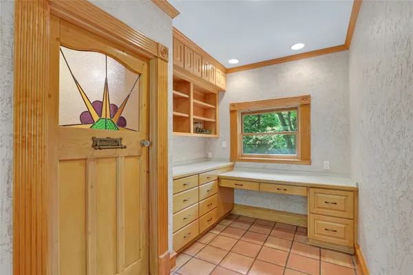 a bedroom with furniture window and a table