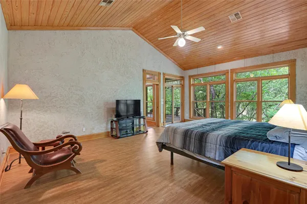 a bathroom with a granite countertop sink mirror and a bathtub