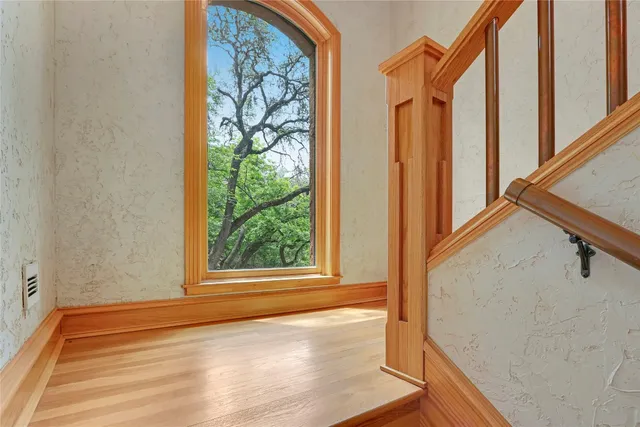 a kitchen with wooden cabinets