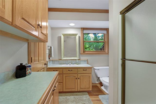 a bedroom with furniture and large windows