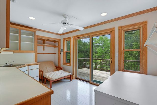 a view of balcony with wooden floor and outdoor seating