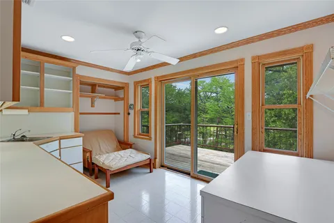 a view of balcony with wooden floor and outdoor seating