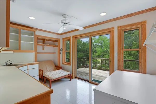 a view of balcony with wooden floor and outdoor seating