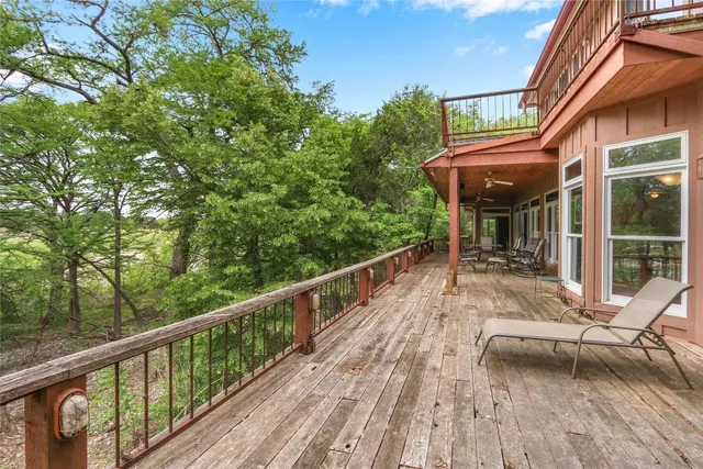 a balcony with trees in front of it