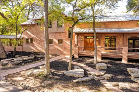 a room with pool table and windows