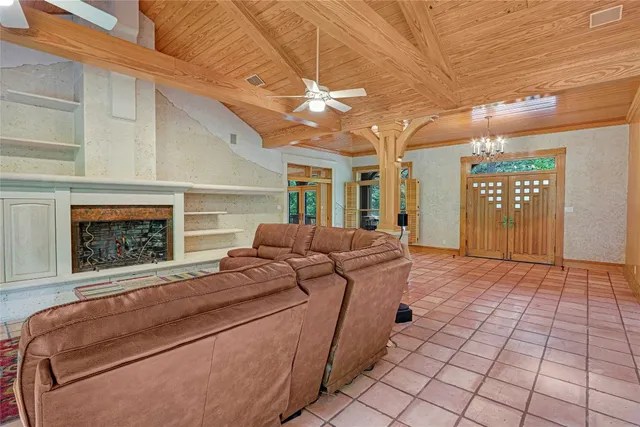 a view of a kitchen with a sink and large window