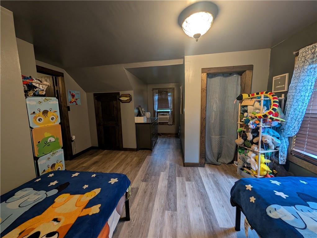 205 Woods Road Ligonier, PA 15658 - Photo 16 of 32 a very nice looking room with wooden floor and a flat screen tv