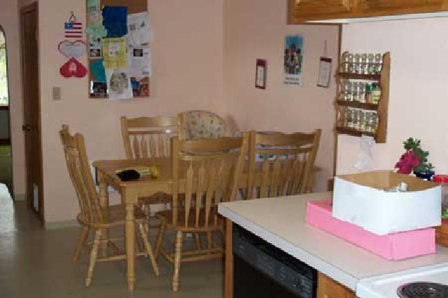 1800 Stone Road Yakima, WA 98908 - Photo 3 of 9 a view of a dining room with furniture and wooden floor