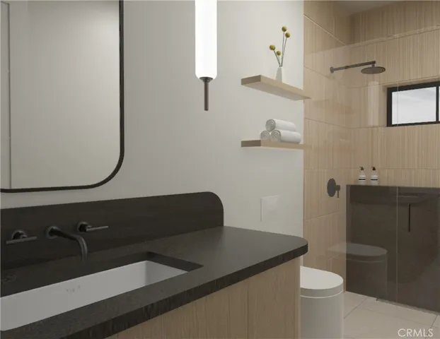 a bathroom with a sink a toilet and a mirror