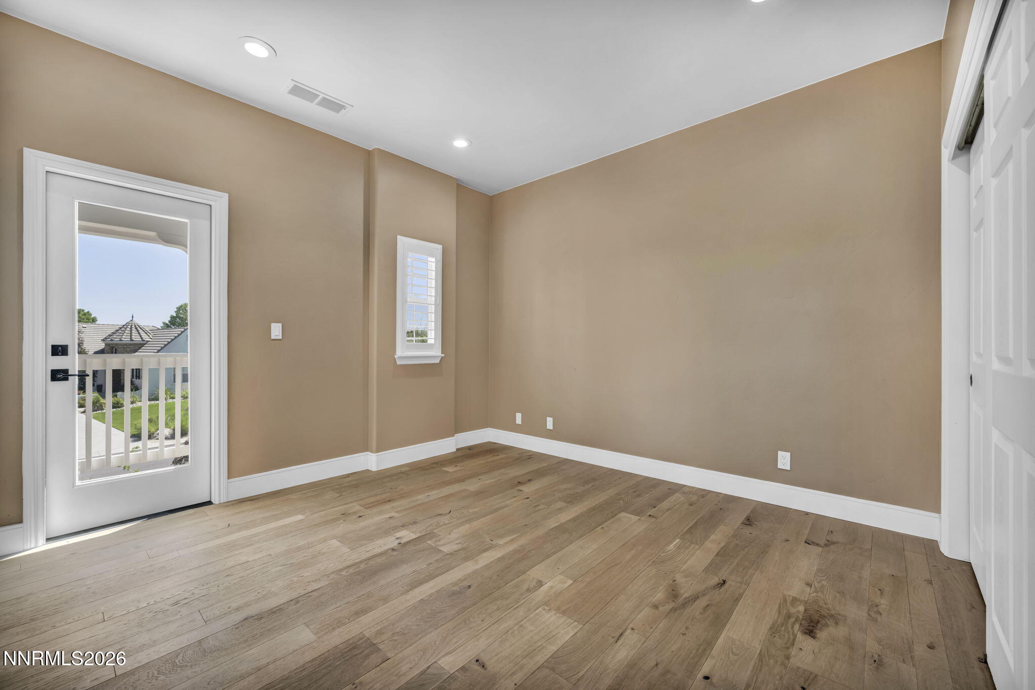2965 Roundrock Court Reno, NV 89511 - Photo 27 of 40 a view of an empty room with wooden floor and a window