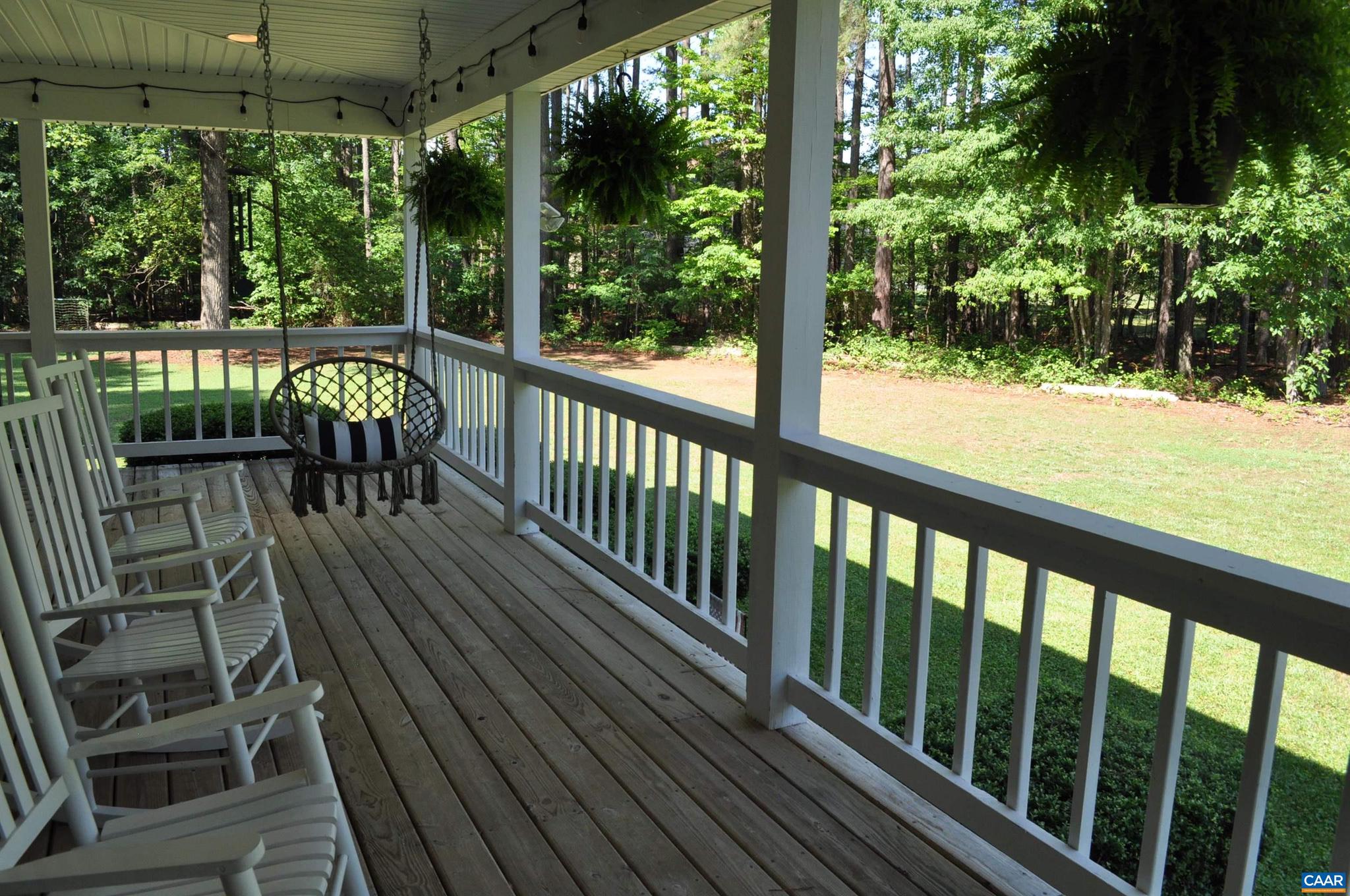 3257 Martin Kings Road Charlottesville, VA 22902 - Photo 42 of 49 a view of a balcony with chairs and wooden floor