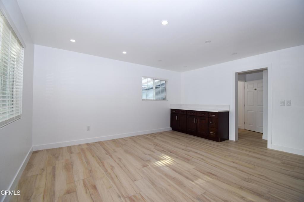 2711 Altus Way, Unit 2 Oxnard, CA 93035 - Photo 3 of 10 wooden floor in an empty room with a window