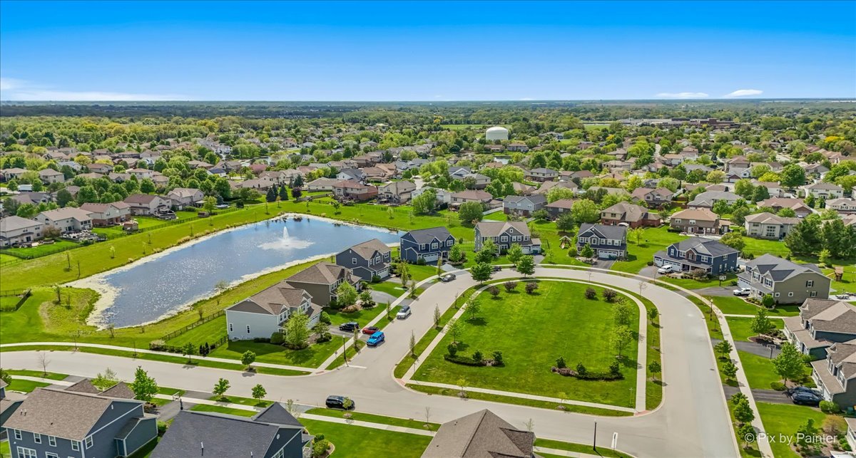 16207 West Switch Grass Road Lockport, IL 60441 - Photo 38 of 45 an aerial view of a residential houses with outdoor space and a lake view