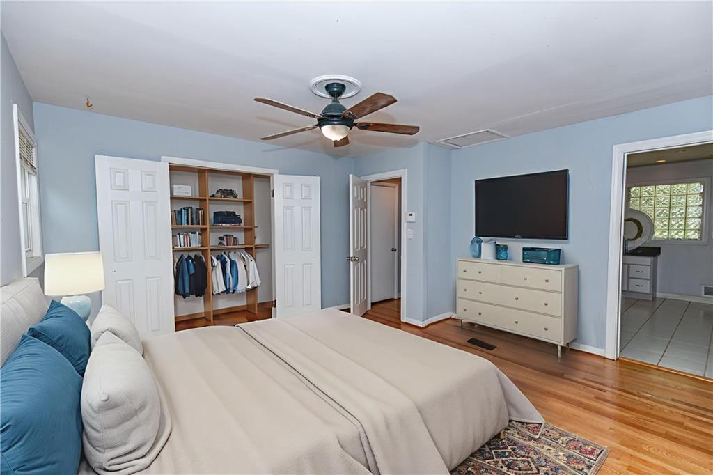3175 Alton Road Atlanta, GA 30341 - Photo 28 of 76 a bedroom with a bed and a flat screen tv