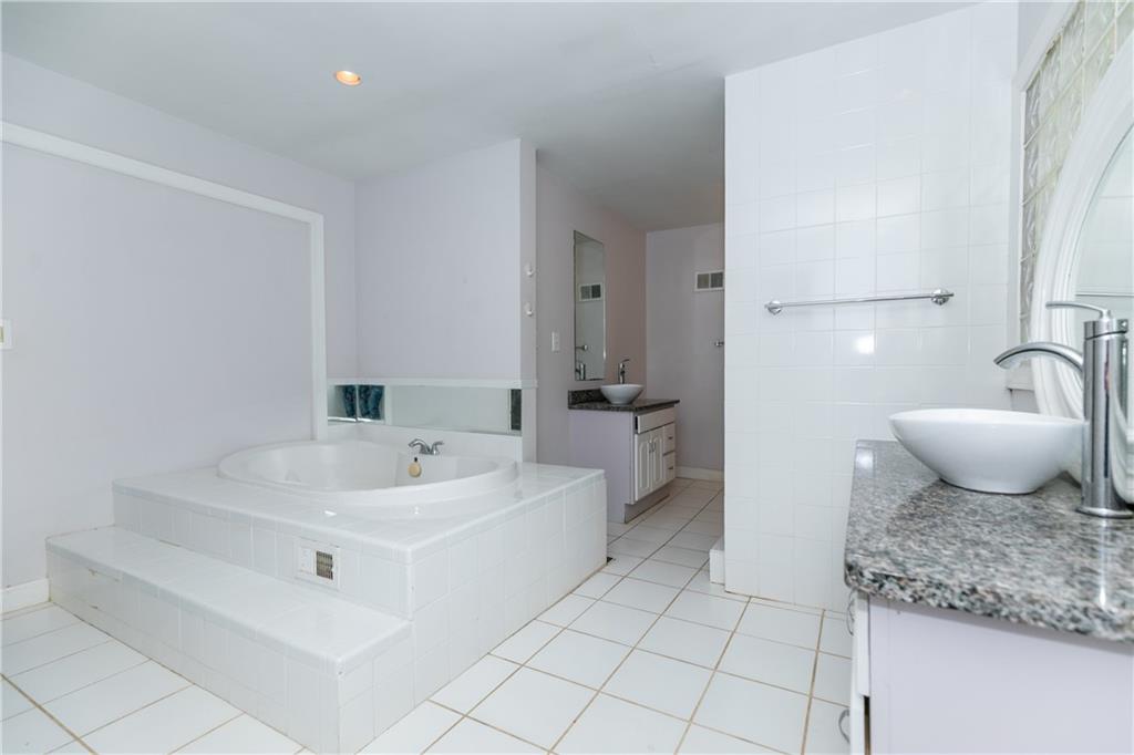 3175 Alton Road Atlanta, GA 30341 - Photo 33 of 76 a bathroom with a sink and a mirror