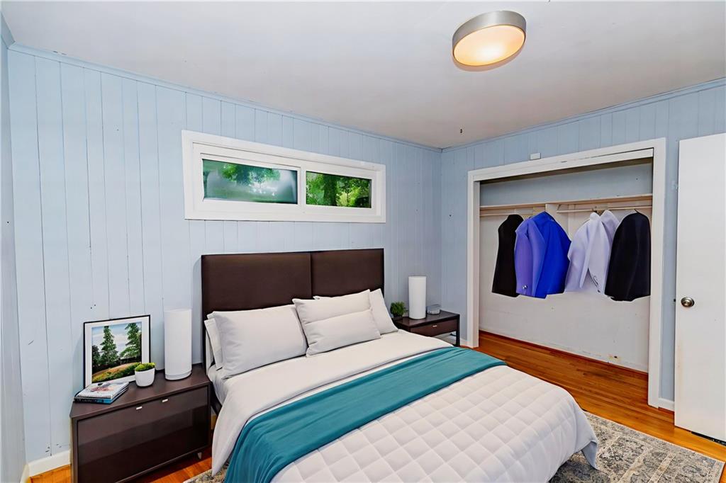 3175 Alton Road Atlanta, GA 30341 - Photo 46 of 76 a bedroom with a bed and painting on the wall