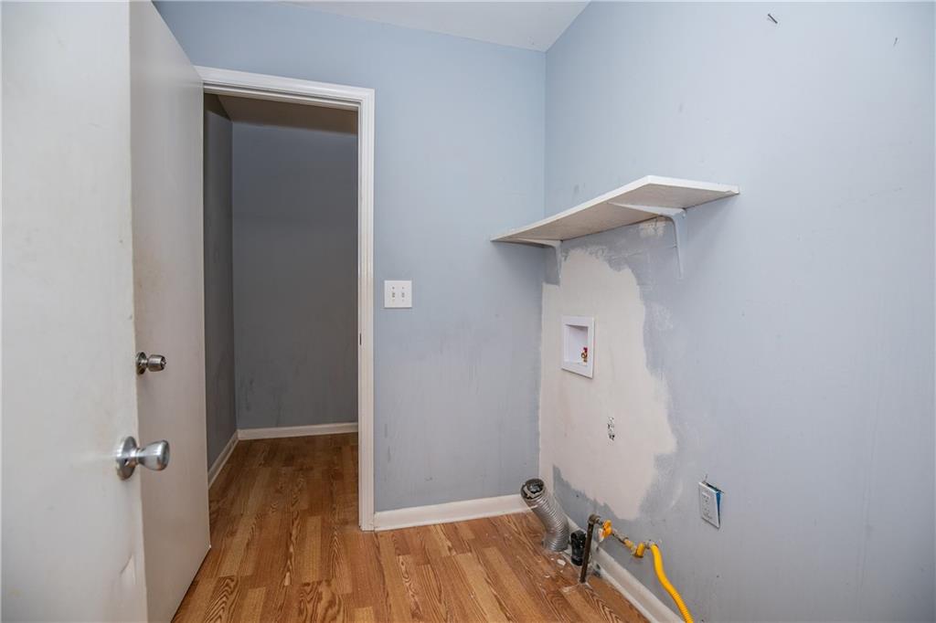 3175 Alton Road Atlanta, GA 30341 - Photo 63 of 76 a view of a room with wooden floor and a ceiling fan