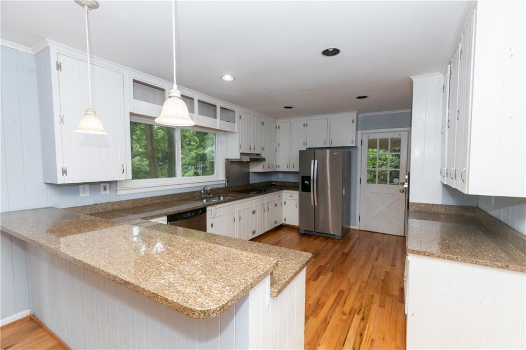 3175 Alton Road Atlanta, GA 30341 - Photo 8 of 76 a kitchen with stainless steel appliances granite countertop a sink refrigerator and microwave