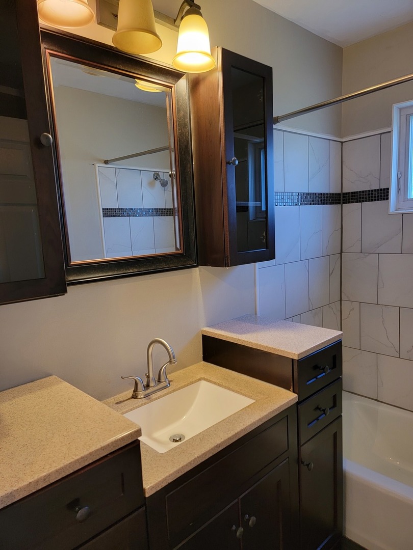 508 Skyline Drive Fox River Grove, IL 60021 - Photo 13 of 24 a bathroom with a sink and a mirror