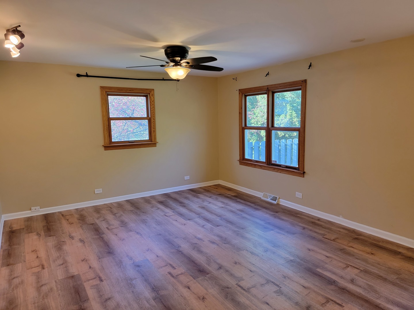 508 Skyline Drive Fox River Grove, IL 60021 - Photo 17 of 24 a view of an empty room with wooden floor and a window
