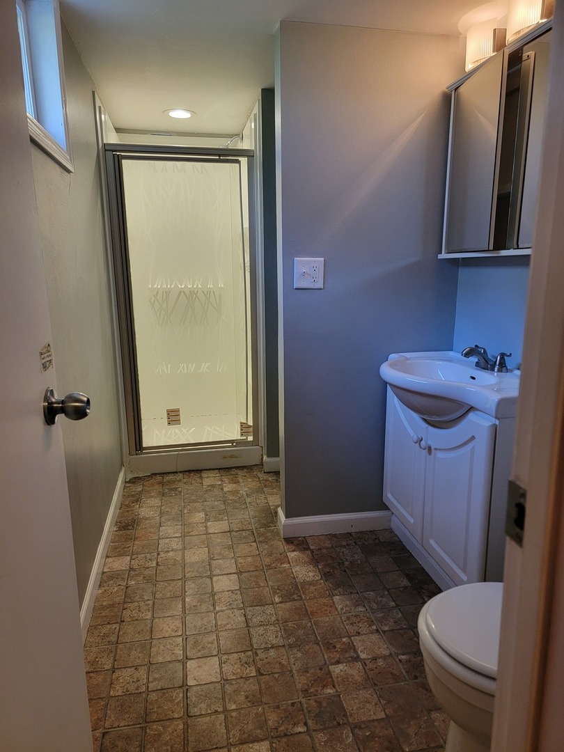 508 Skyline Drive Fox River Grove, IL 60021 - Photo 20 of 24 a bathroom with a sink a toilet and a shower