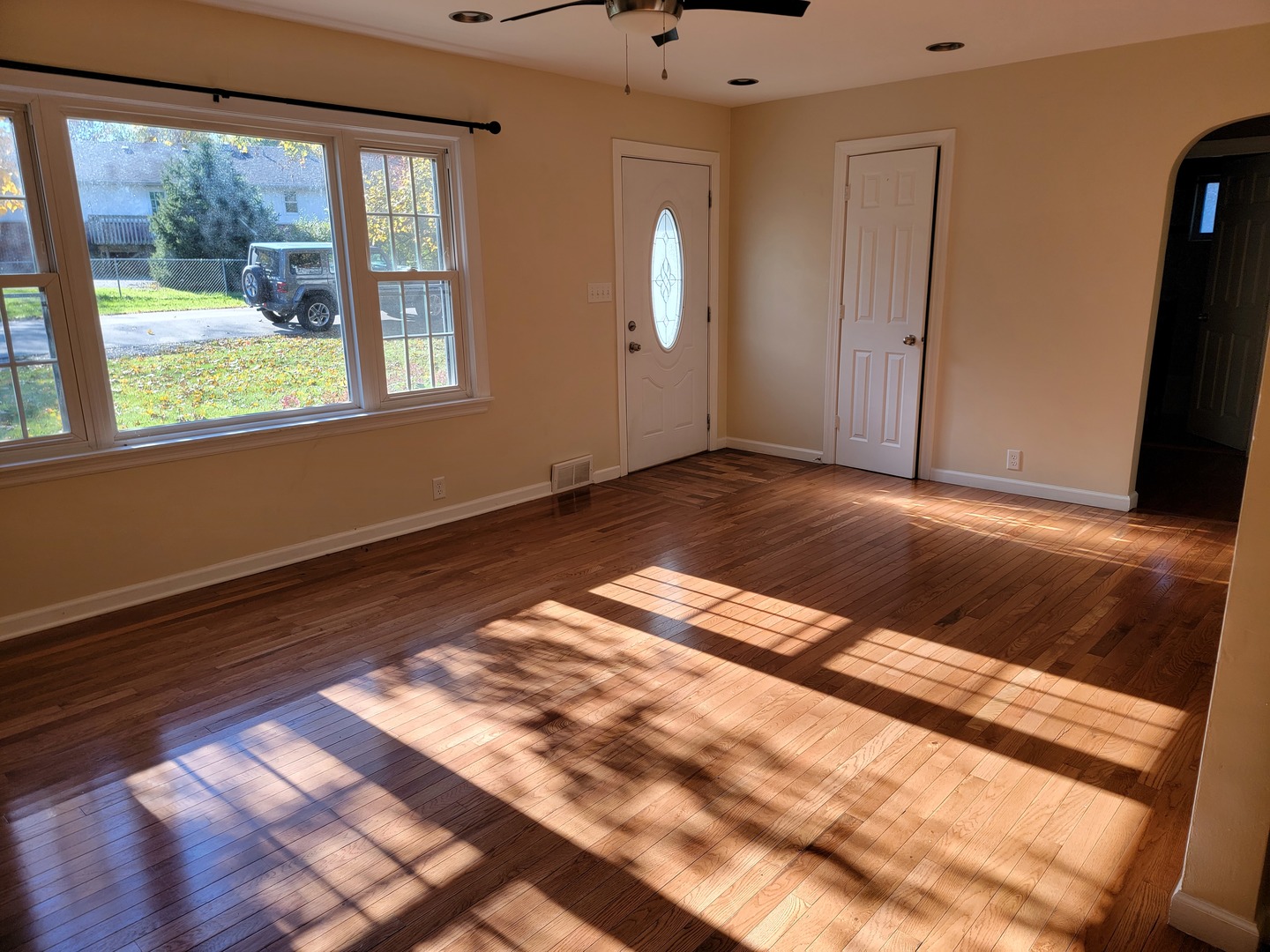 508 Skyline Drive Fox River Grove, IL 60021 - Photo 3 of 24 a view of an empty room with wooden floor and a window