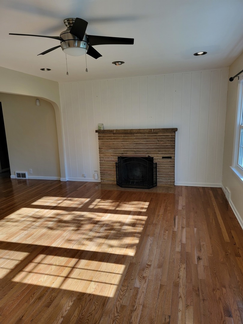 508 Skyline Drive Fox River Grove, IL 60021 - Photo 4 of 24 a view of empty room with wooden floor and fireplace