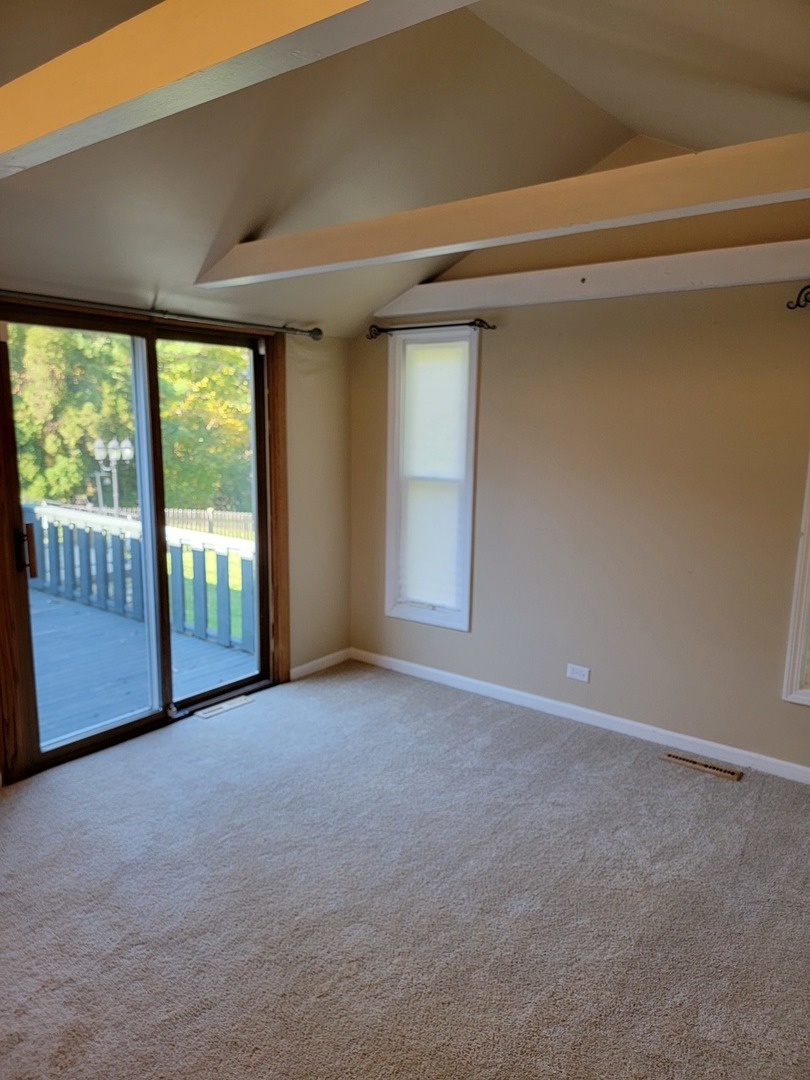 508 Skyline Drive Fox River Grove, IL 60021 - Photo 8 of 24 a view of empty room with floor to ceiling window