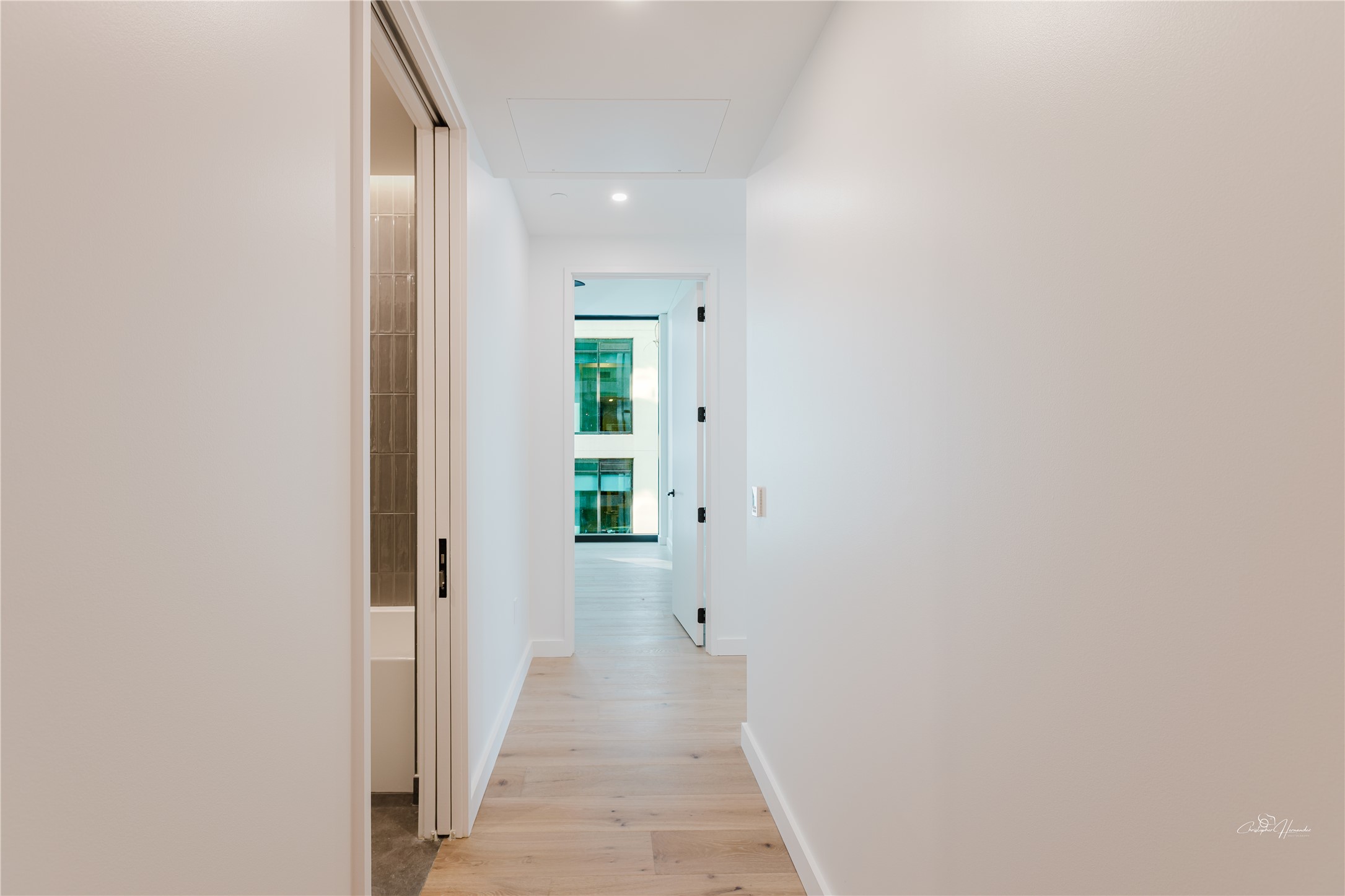 610 Davis Street, Unit 2608 Austin, TX 78701 - Photo 10 of 39 a view of a hallway with wooden floor
