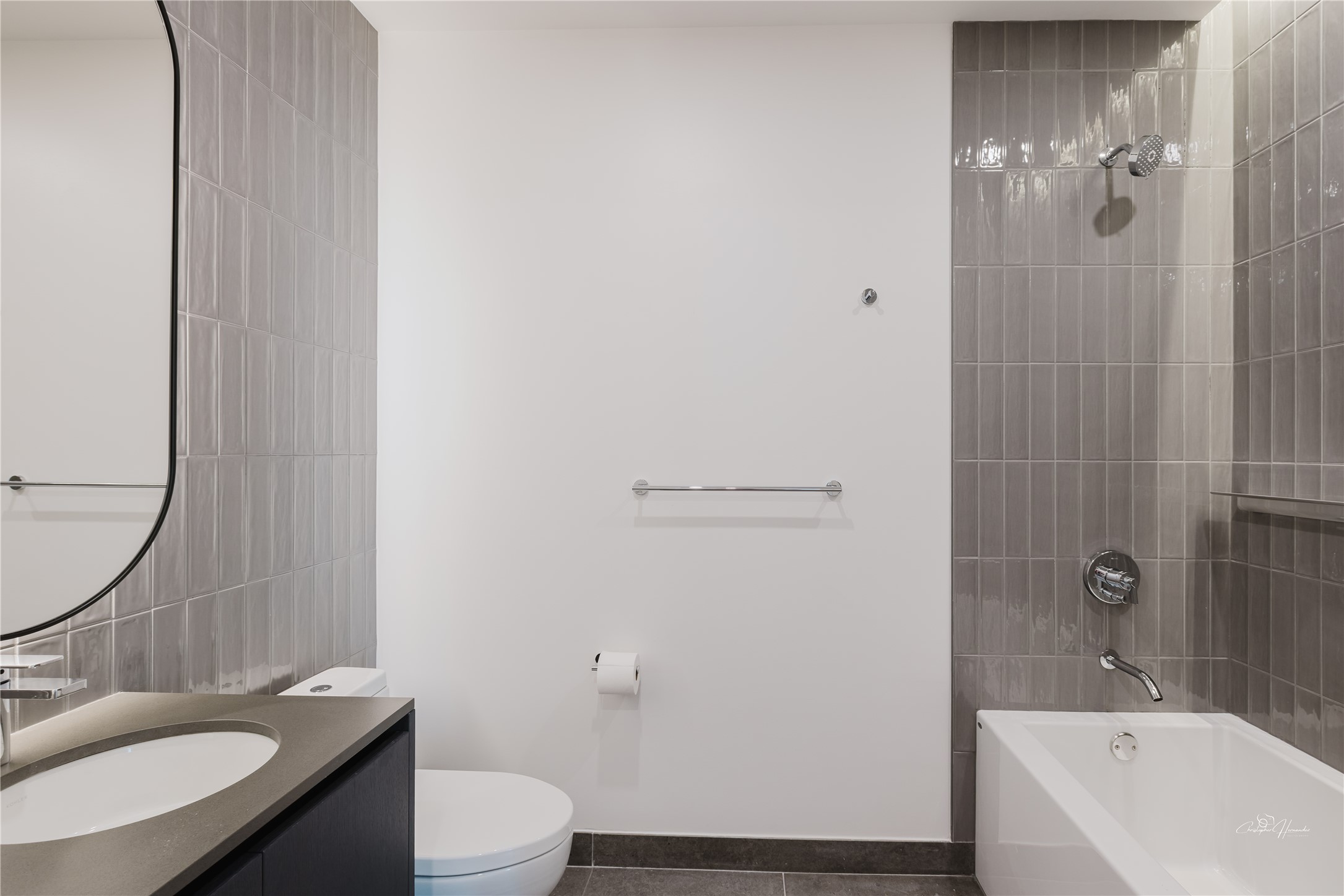 610 Davis Street, Unit 2608 Austin, TX 78701 - Photo 17 of 39 a bathroom with a sink a toilet and shower