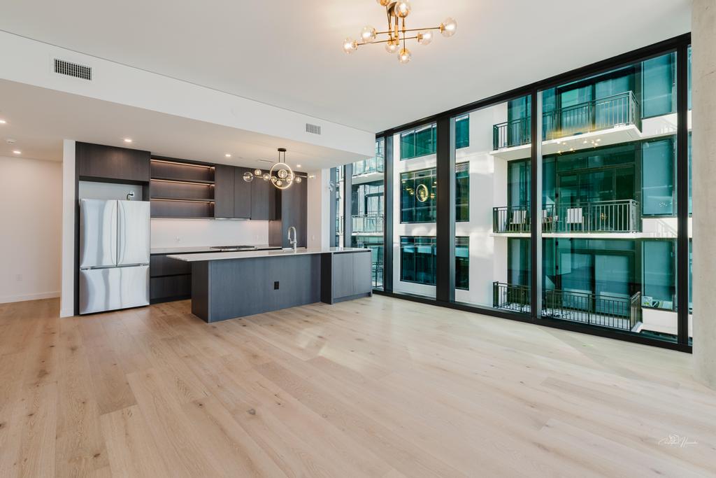 610 Davis Street, Unit 2608 Austin, TX 78701 - Photo 2 of 39 a view of a kitchen with a sink and a large window