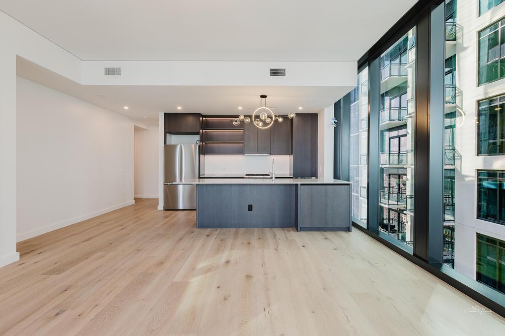 610 Davis Street, Unit 2608 Austin, TX 78701 - Photo 39 of 39 a view of a kitchen with a sink and a refrigerator