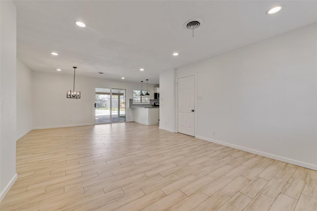 413 Simmons Drive Hurst, TX 76053 - Photo 24 of 26 a view of empty room with wooden floor