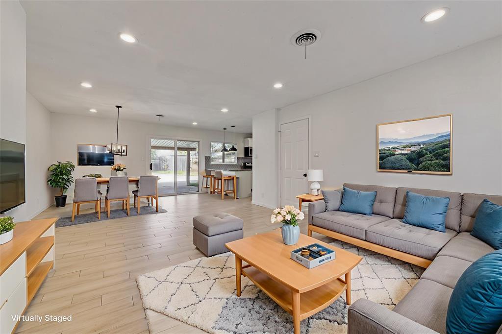 413 Simmons Drive Hurst, TX 76053 - Photo 3 of 26 a living room with furniture and a view of kitchen