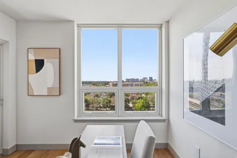 a view of a window and chair in a room