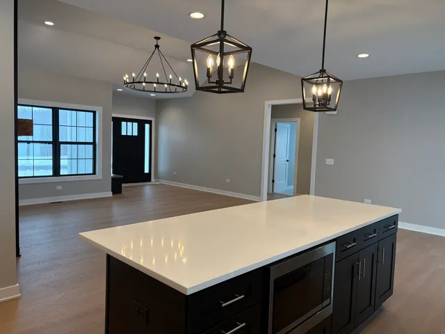 a view of a kitchen and a chandelier