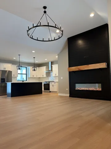 a view of kitchen with microwave and cabinets