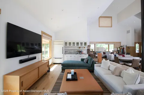 a bathroom with a double vanity sink a mirror and a bathtub