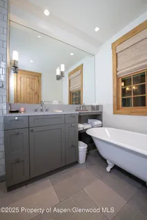a stove top oven sitting inside of a kitchen