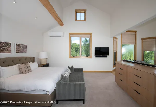 a view of a grassy field with trees