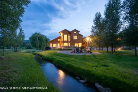 a big yard with lots of green space and trees