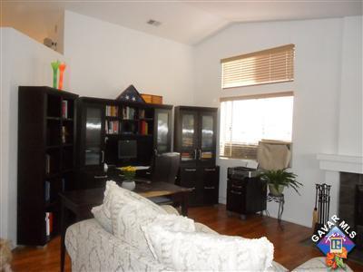 3248 Shale Road Palmdale, CA 93550 - Photo 3 of 19 a bed room with a bed and a television