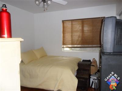 3248 Shale Road Palmdale, CA 93550 - Photo 9 of 19 a bedroom with a bed and a window