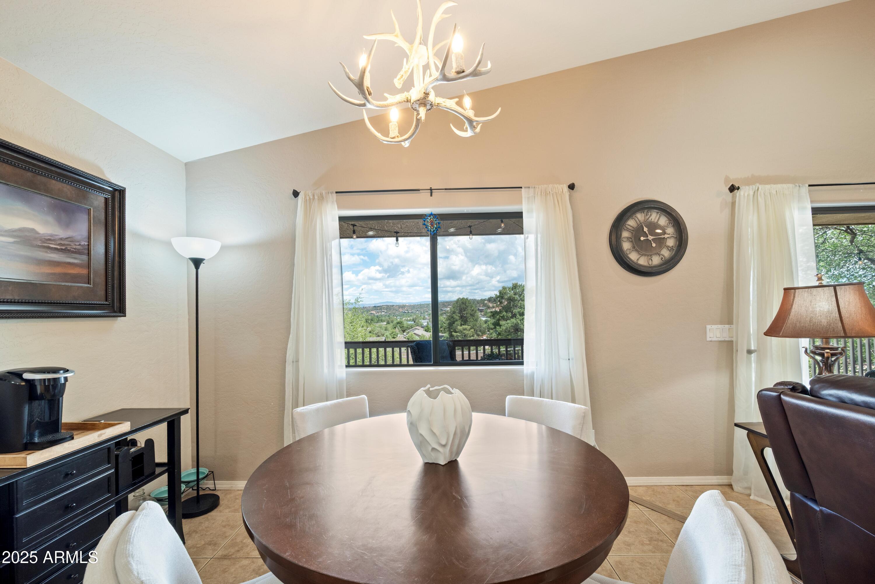 814 West Rim View Road Payson, AZ 85541 - Photo 16 of 42 a view of a dining room with furniture window and wooden floor