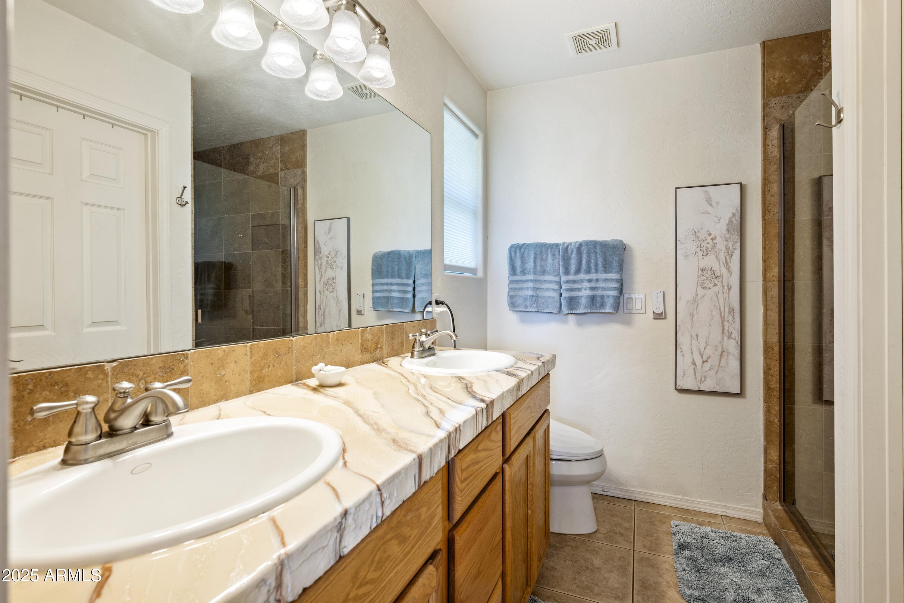 814 West Rim View Road Payson, AZ 85541 - Photo 23 of 42 a bathroom with a sink a toilet and mirror
