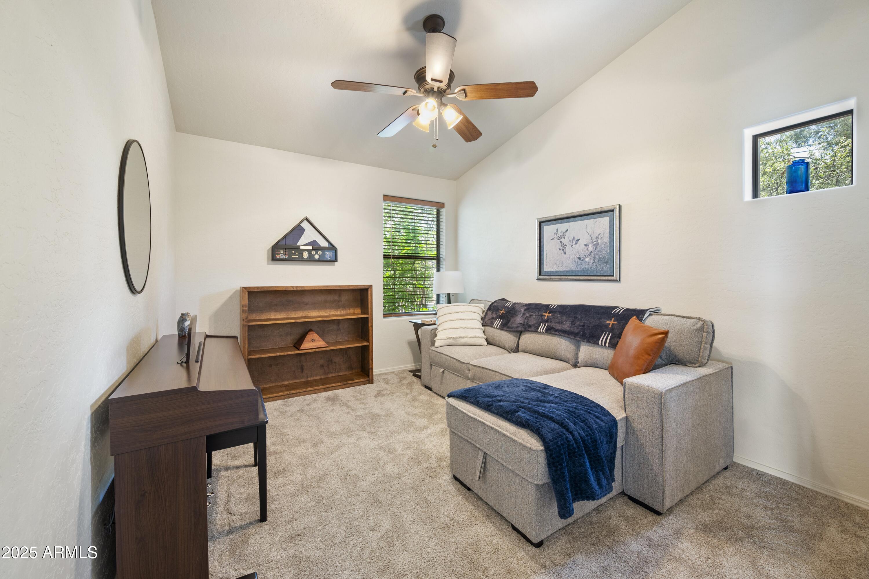 814 West Rim View Road Payson, AZ 85541 - Photo 26 of 42 a living room with furniture a wall paintings a piano and a window