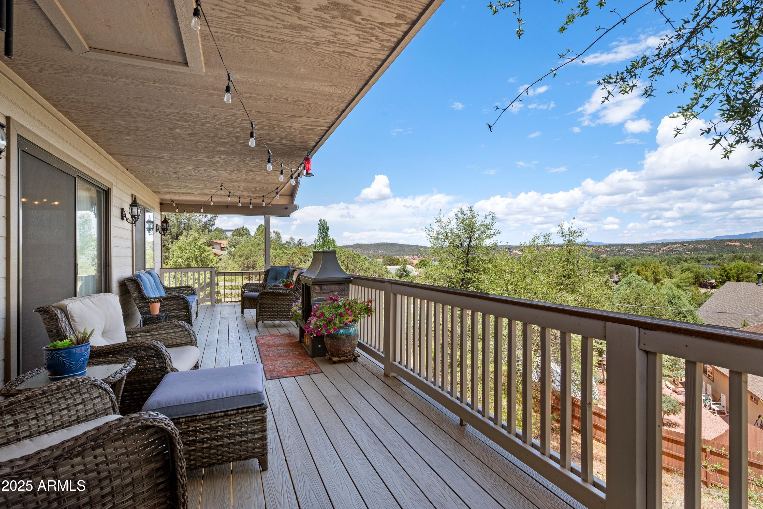 814 West Rim View Road Payson, AZ 85541 - Photo 31 of 42 a view of balcony with chairs and wooden floor
