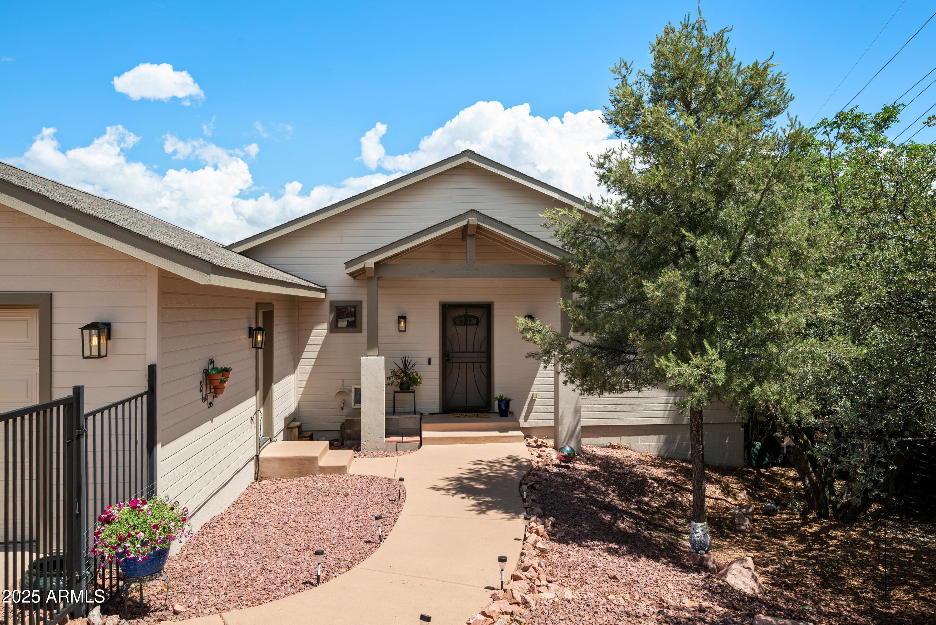 814 West Rim View Road Payson, AZ 85541 - Photo 4 of 42 a view of a house with a porch