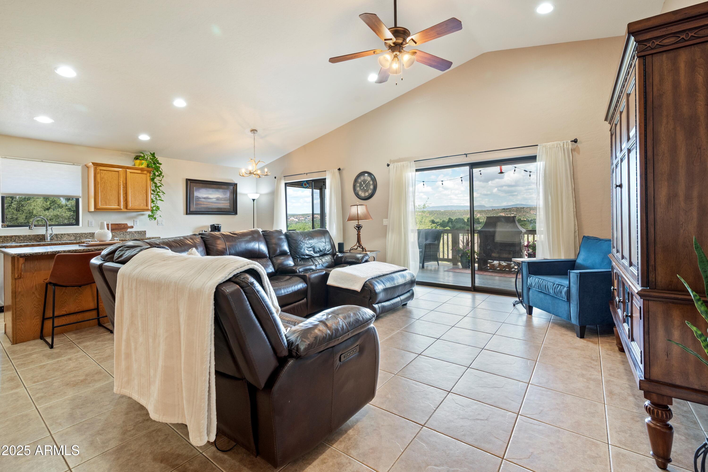 814 West Rim View Road Payson, AZ 85541 - Photo 9 of 42 a living room with furniture and a flat screen tv